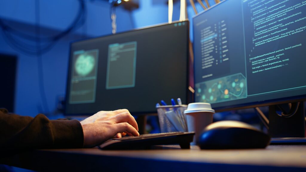 Technician monitoring computer screens for virus removal services