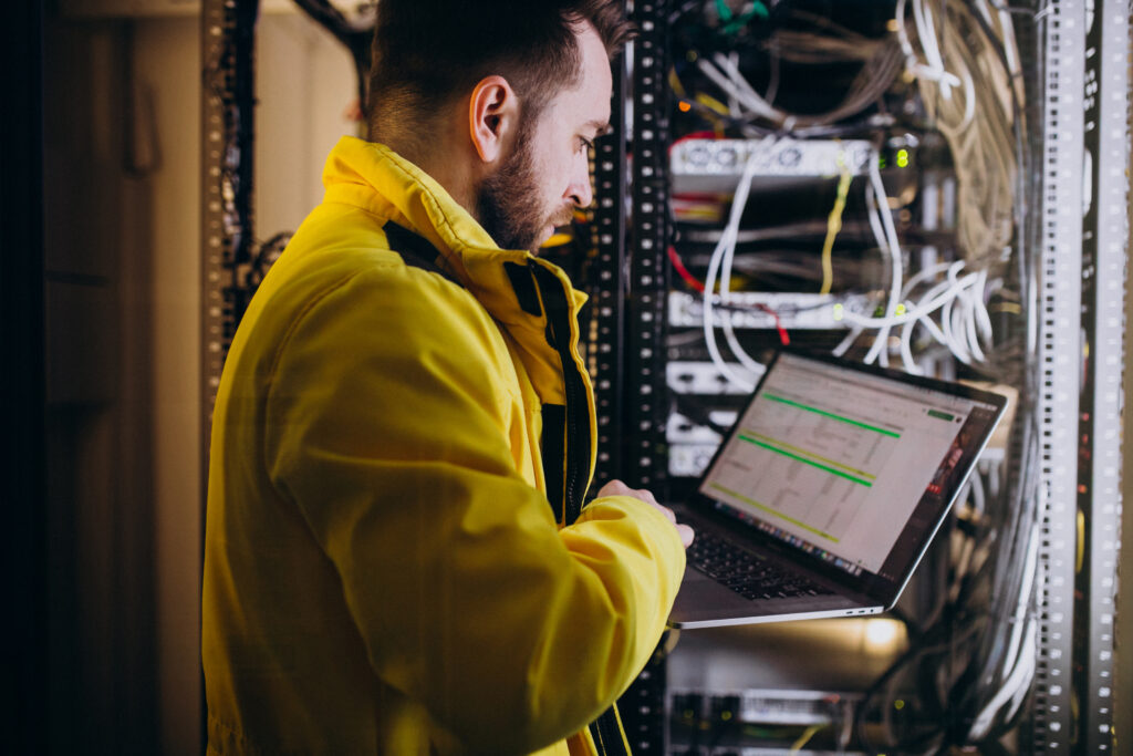 Technician configuring network equipment for business networking services